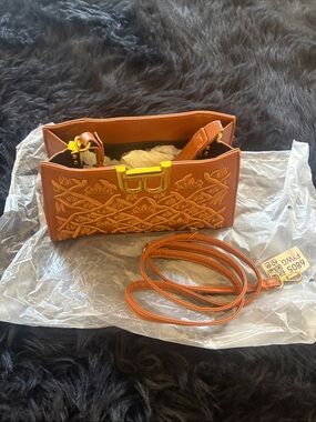 Stylish Embossed Orange Crossbody Bag with Gold Hardware